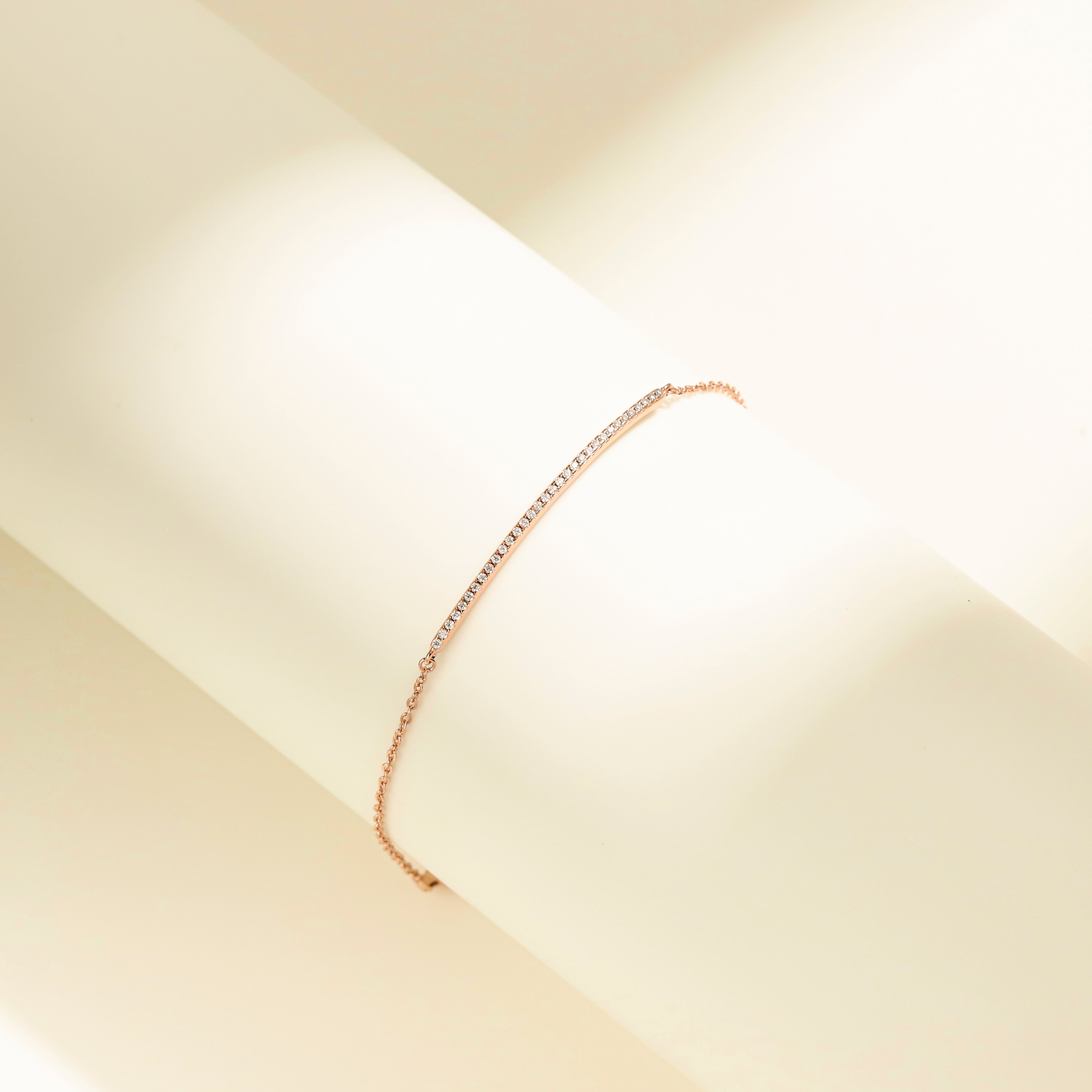 Minimalist Arc Charm Bracelet in 18 carat rose gold vermeil, adorned with a Moissanite arc design and an adjustable chain, perfect for daily wear or as a thoughtful gift.