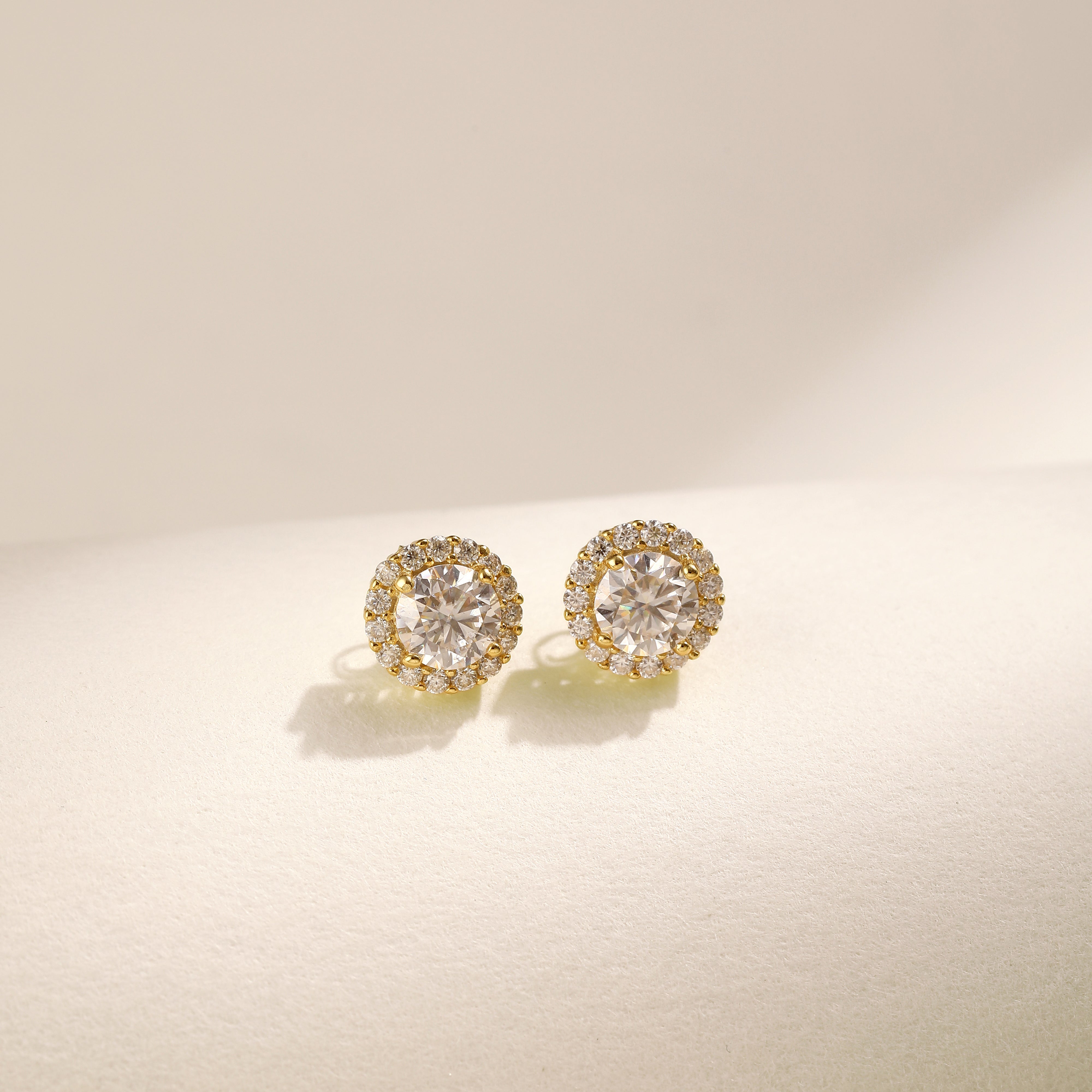 Brilliance Halo Studs in 18 carat gold vermeil, featuring a brilliant Moissanite center stone surrounded by a halo of smaller stones, perfect for daily wear or as a thoughtful gift.