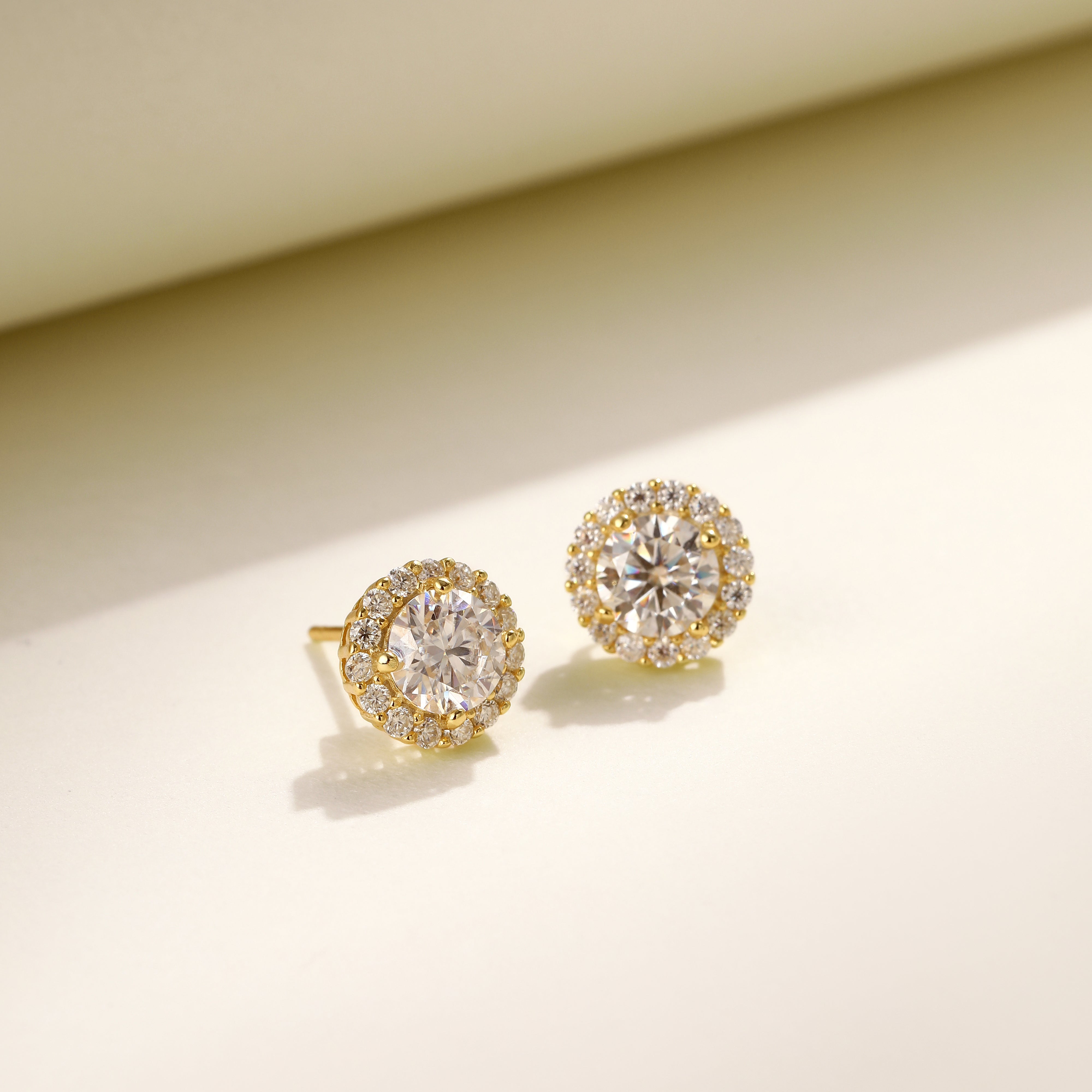 Brilliance Halo Studs in 18 carat gold vermeil, featuring a brilliant Moissanite center stone surrounded by a halo of smaller stones, perfect for daily wear or as a thoughtful gift.