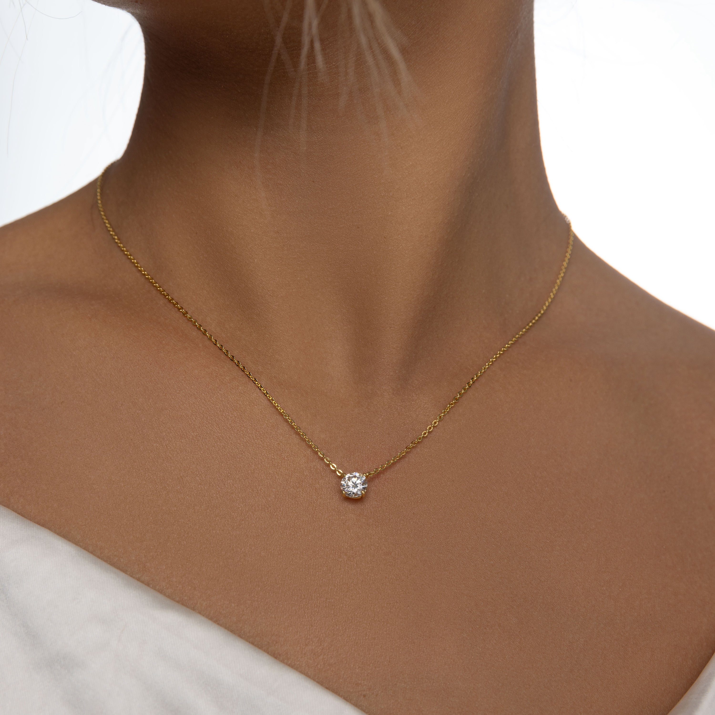 A single brilliant Moissanite solitaire stone set on an 18 carat gold vermeil adjustable chain, perfect for daily wear or as a thoughtful gift.