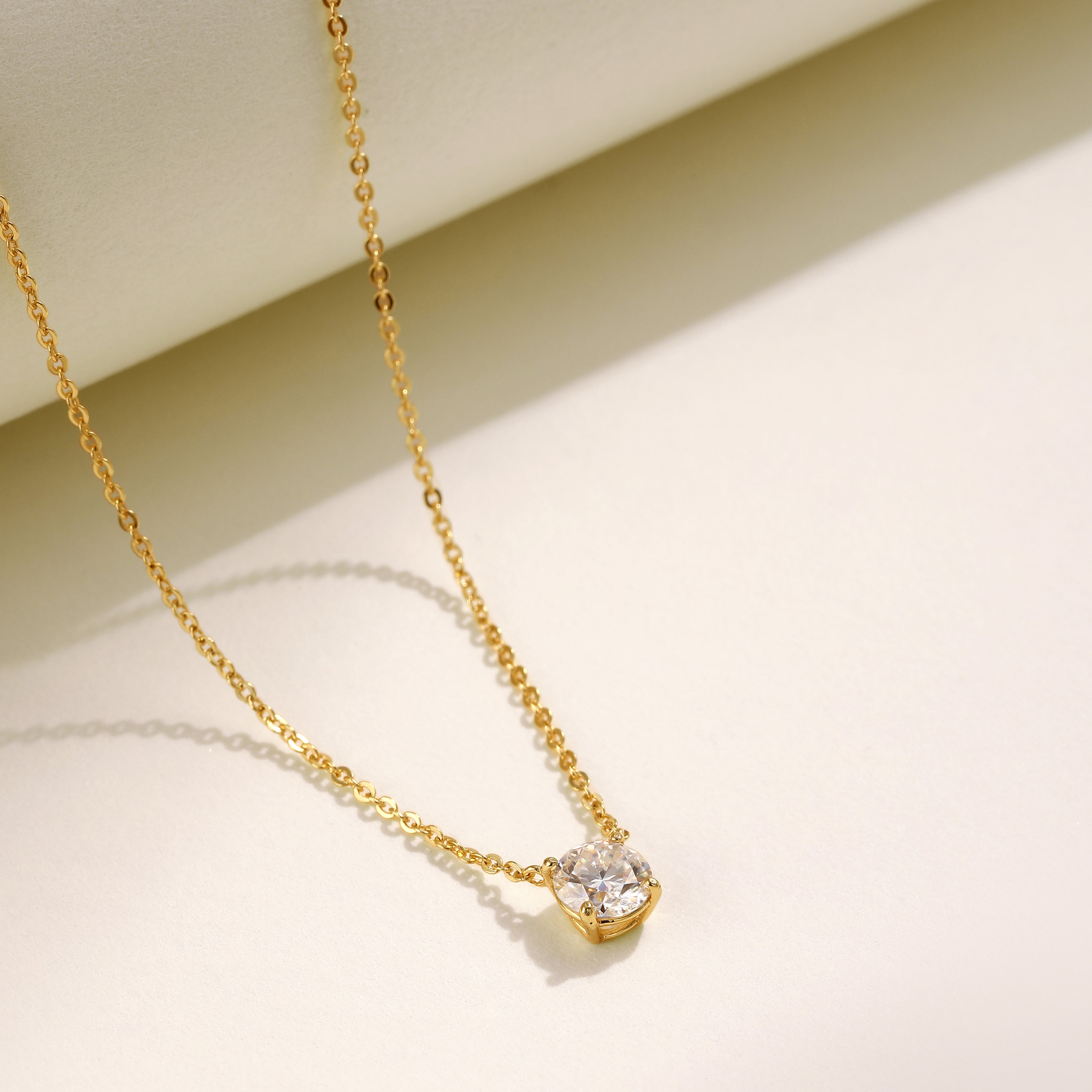 A single brilliant Moissanite solitaire stone set on an 18 carat gold vermeil adjustable chain, perfect for daily wear or as a thoughtful gift.