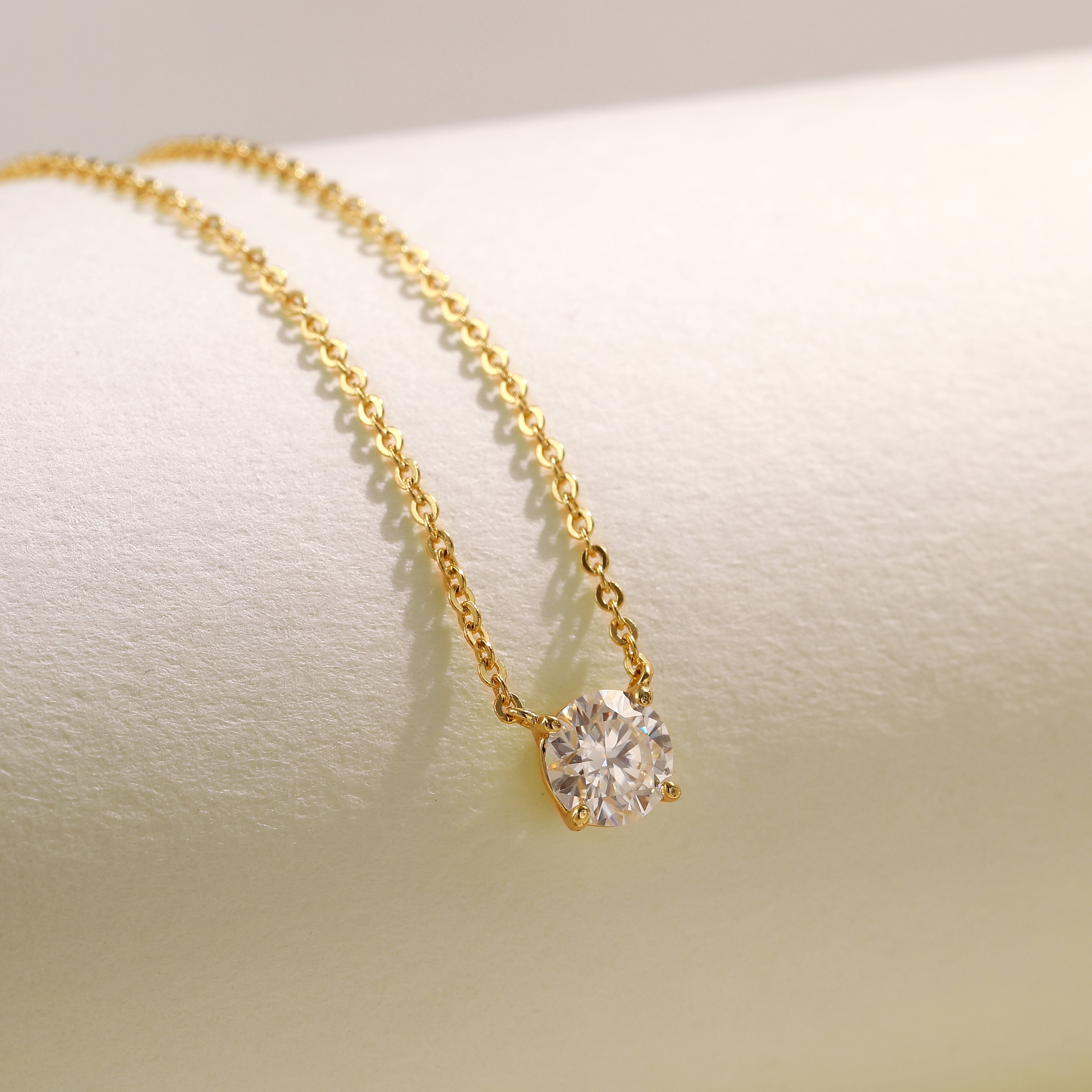 A single brilliant Moissanite solitaire stone set on an 18 carat gold vermeil adjustable chain, perfect for daily wear or as a thoughtful gift.