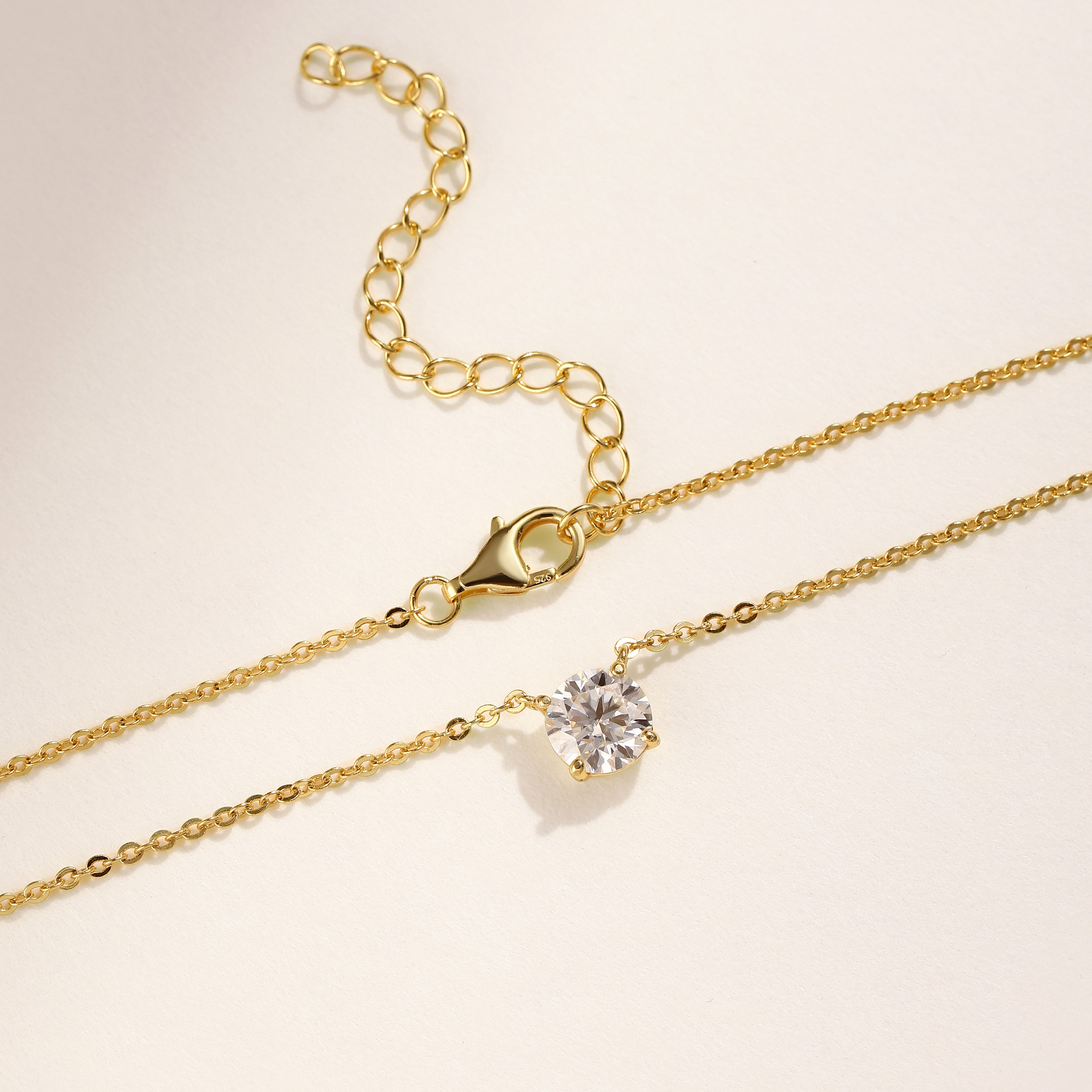 A single brilliant Moissanite solitaire stone set on an 18 carat gold vermeil adjustable chain, perfect for daily wear or as a thoughtful gift.