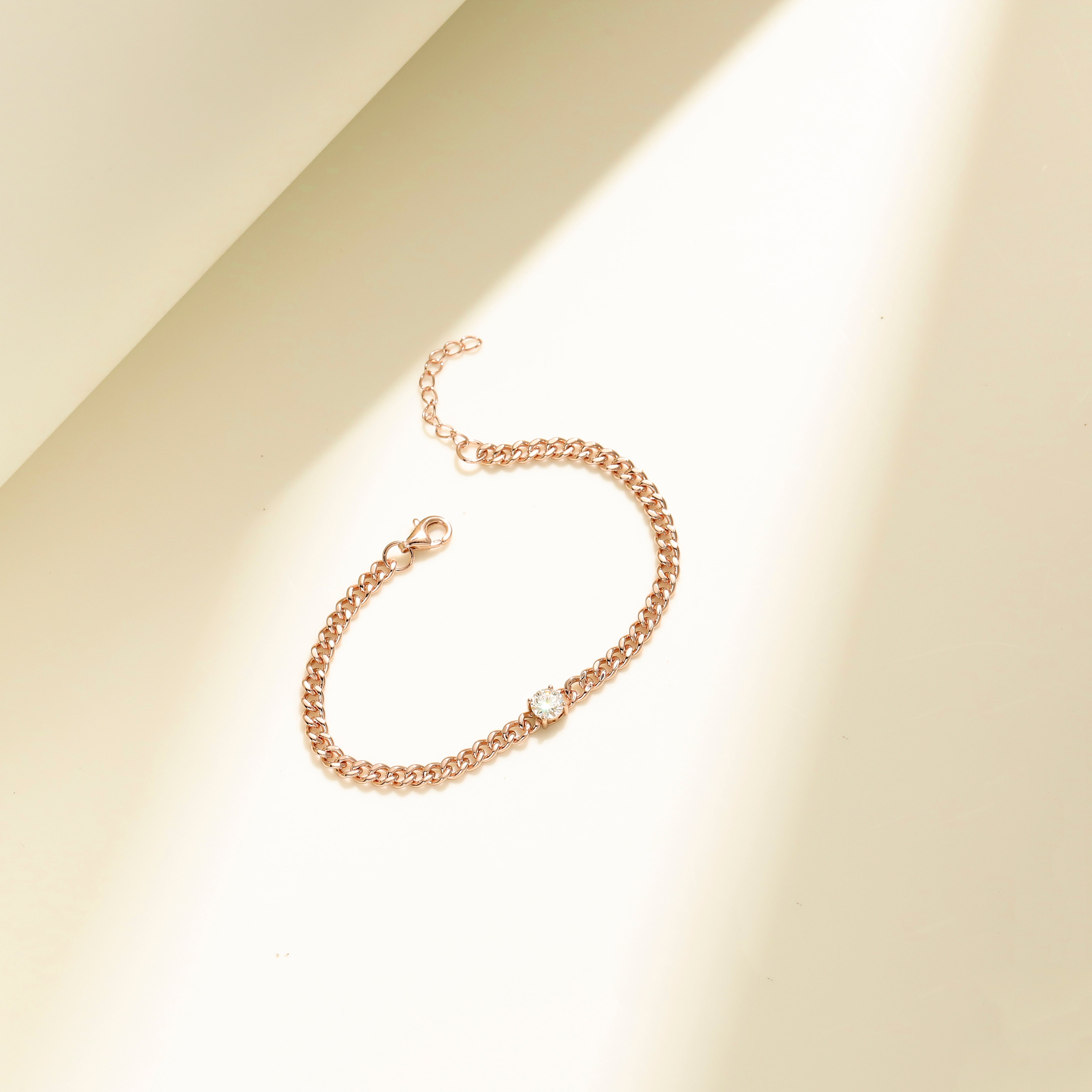 Minimalist chain bracelet in 18 carat rose gold vermeil featuring a single Moissanite stone with adjustable chain, perfect for daily wear or as a thoughtful gift.