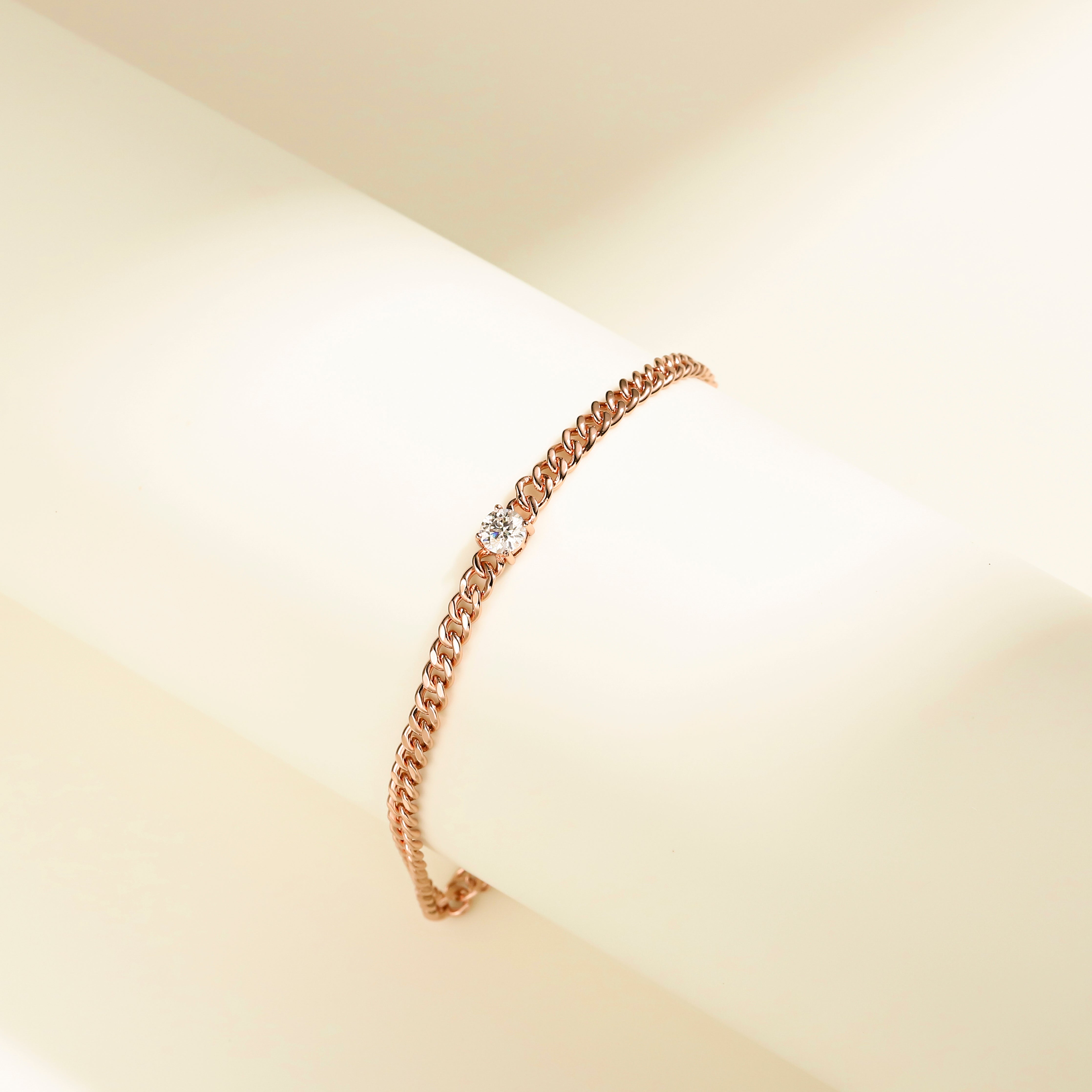 Minimalist chain bracelet in 18 carat rose gold vermeil featuring a single Moissanite stone with adjustable chain, perfect for daily wear or as a thoughtful gift.