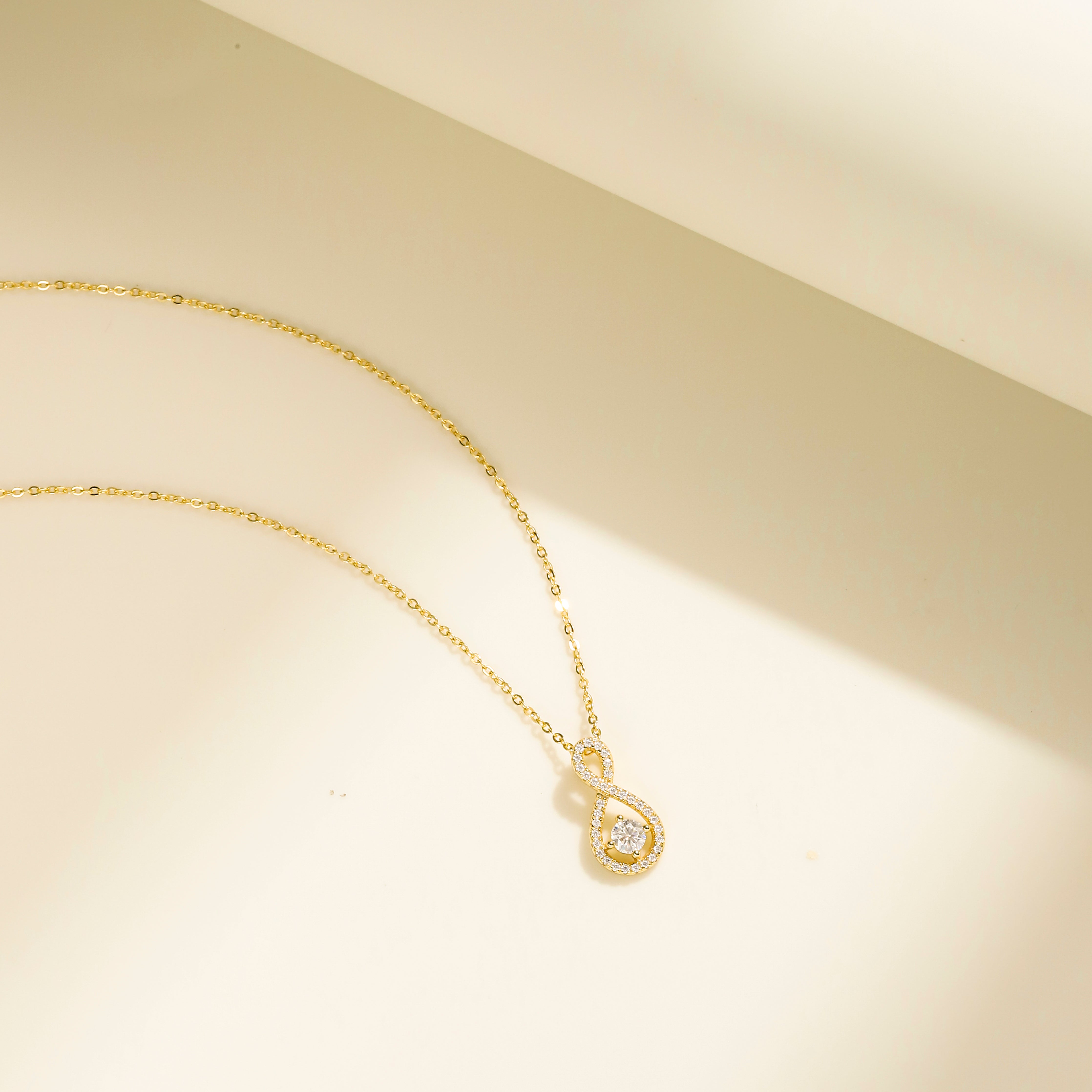 Eternal Loop Necklace in 18 carat gold vermeil featuring an infinity loop design with a center Moissanite stone and adjustable chain, perfect for daily wear or as a thoughtful gift.