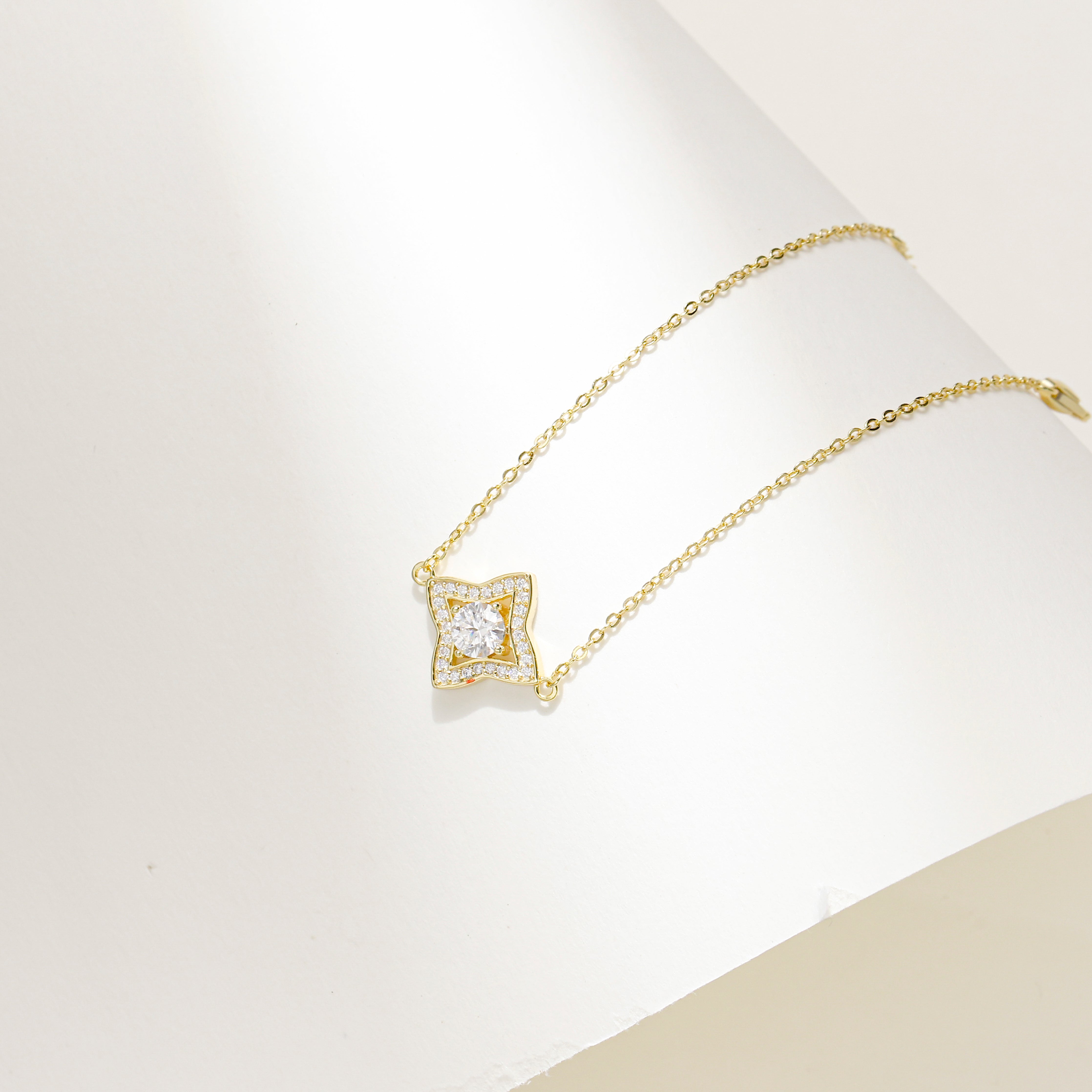 Gold-plated Luxe Star Bracelet featuring a star-shaped charm adorned with sparkling Moissanite stones, displayed on a delicate adjustable chain.