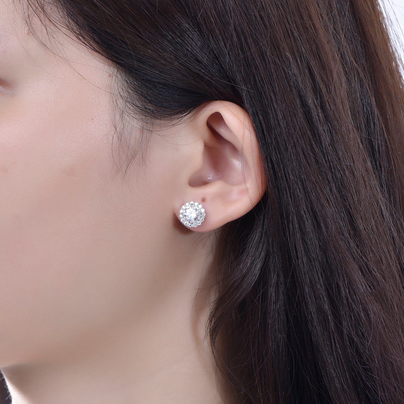 Brilliance Halo Studs in 18 carat white gold vermeil, featuring a brilliant Moissanite center stone surrounded by a halo of smaller stones, perfect for daily wear or as a thoughtful gift.